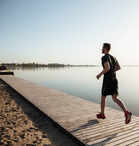 back view full length portrait young sportsman running 1